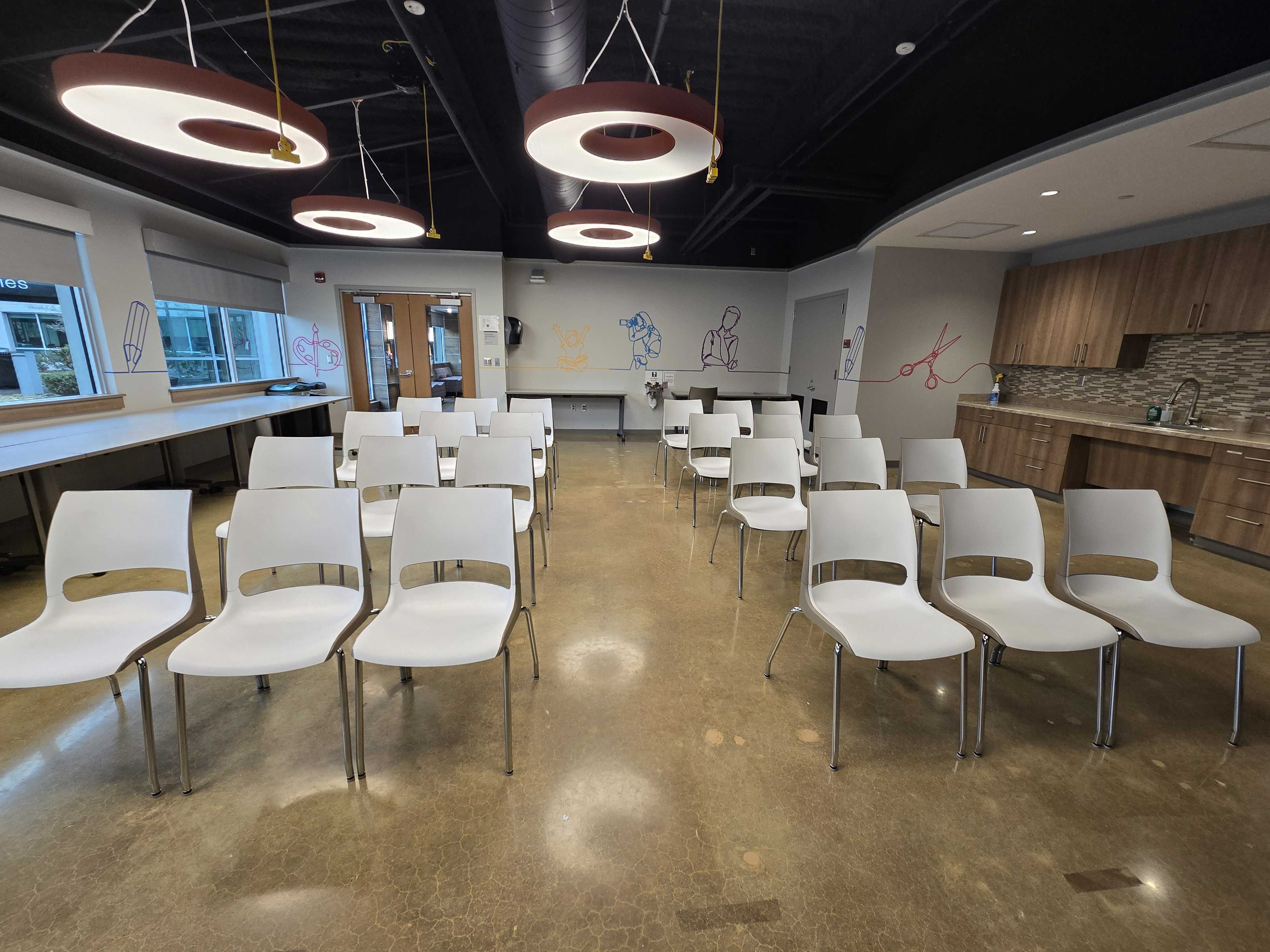 Classroom in theater-style, rows of chairs facing the front