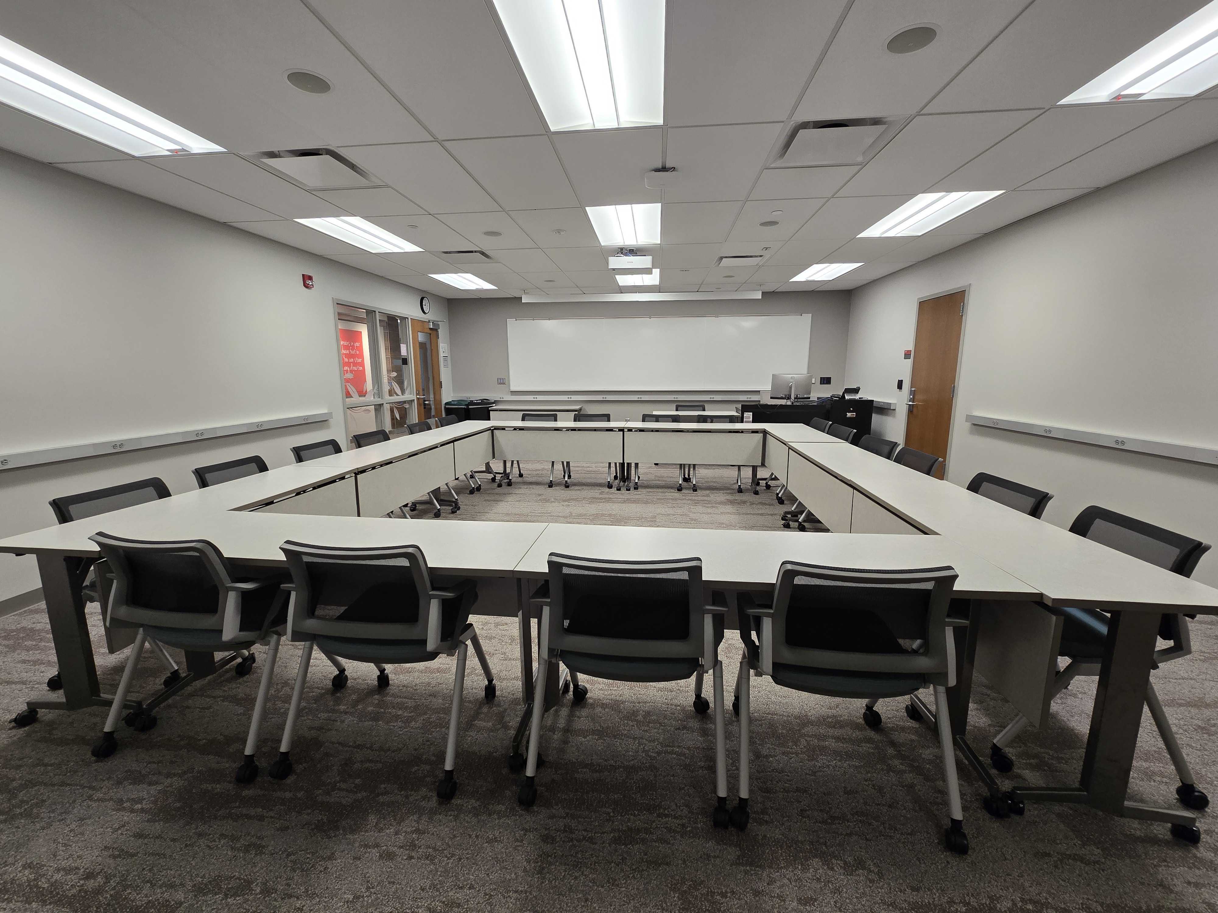 Tables and chairs arranged in a Hollo-Square layout