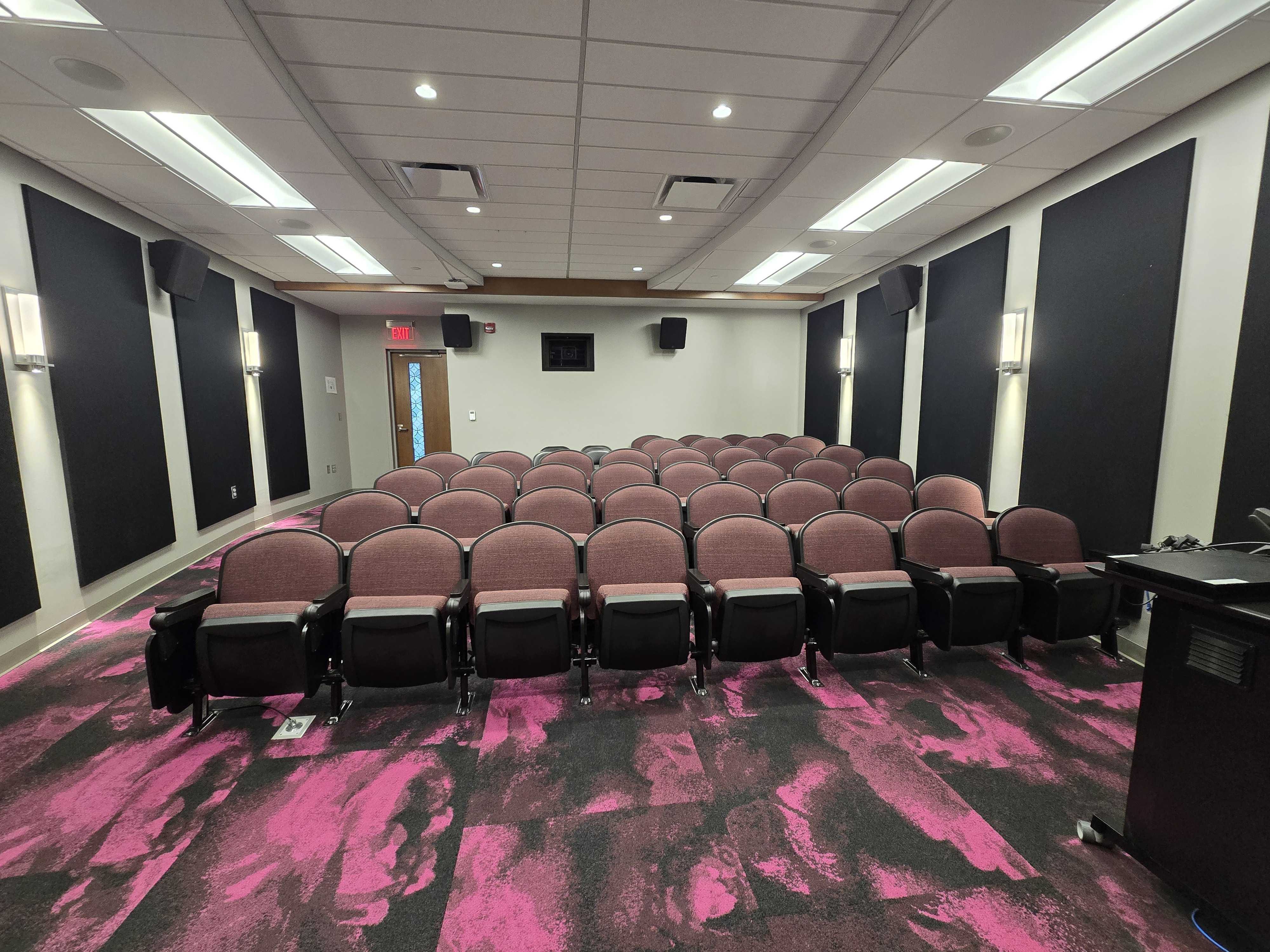 Front-facing out to seats of a theatre-style room