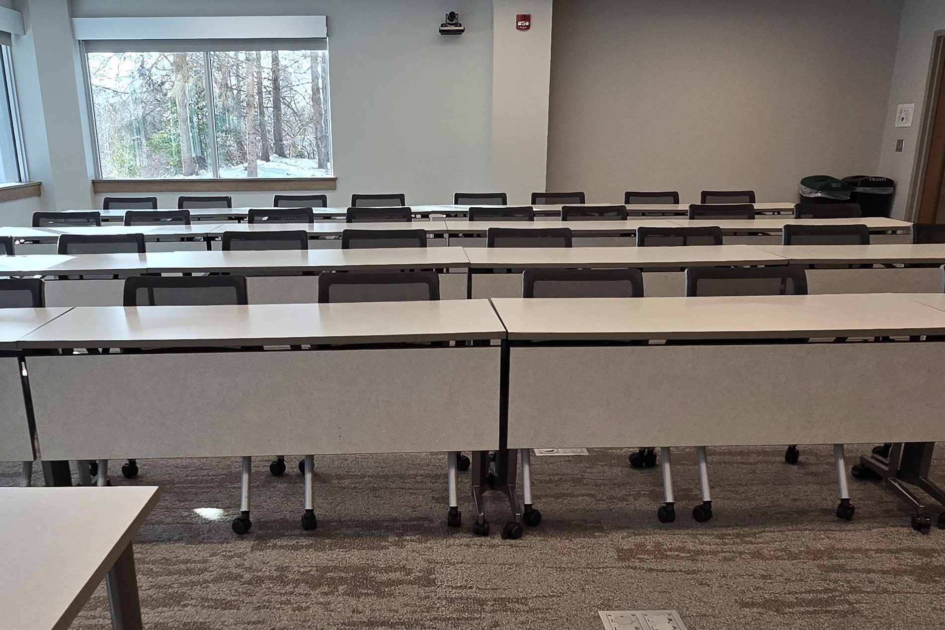 Standard classroom, rows of tables with chairs